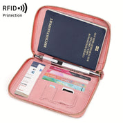 Portafoglio da viaggio rosa con protezione RFID, contiene passaporto, carte di credito e penna. Ideale per organizzare documenti di viaggio.