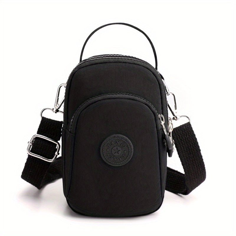 Borsa a tracolla nera in nylon, compatta e resistente, con tasche multiple e cinturino regolabile. Ideale per viaggi e uso quotidiano.