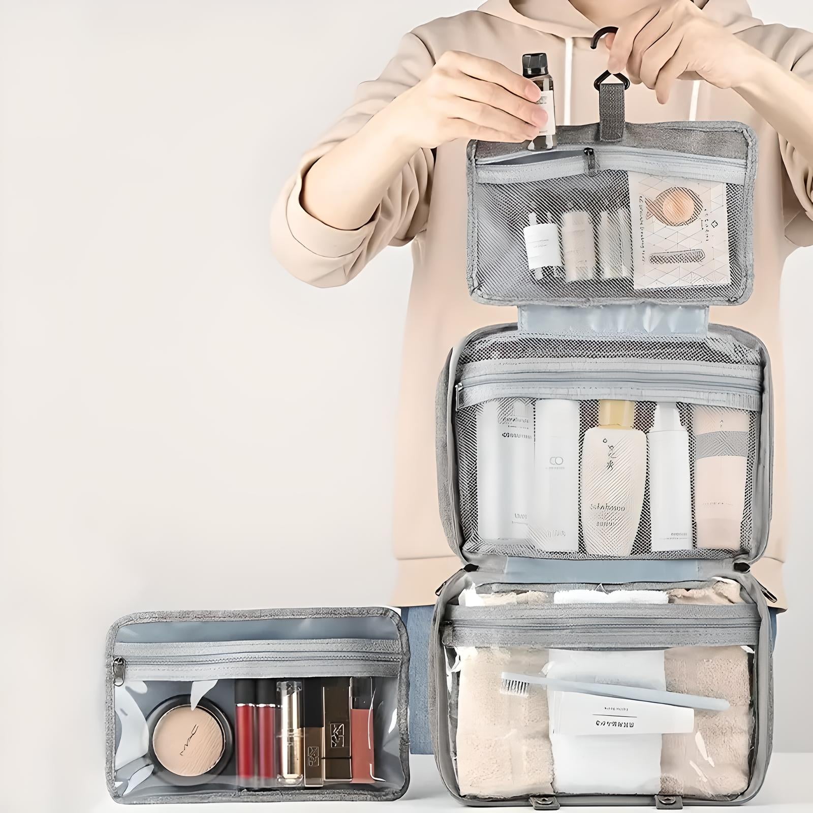 Borsa da viaggio organizer cosmetici grigia, multi-scomparto, con prodotti di bellezza e accessori. Ideale per trucco e skincare.