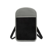 Zaino antifurto grigio e nero, design minimalista, tasca frontale in rete, spallacci regolabili, ideale per viaggi e uso quotidiano.
