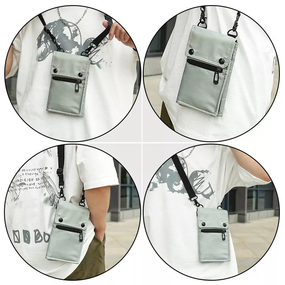 Borsa a tracolla unisex grigia, design compatto con tasca frontale con zip, ideale per viaggi e uso quotidiano. Stile casual e pratico.