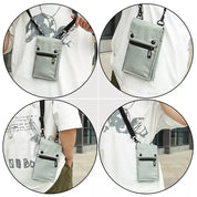 Borsa a tracolla unisex grigia, design compatto con tasca frontale con zip, ideale per viaggi e uso quotidiano. Stile casual e pratico.