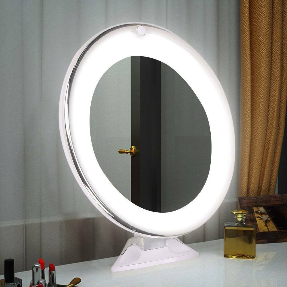 Specchio cosmetico rotondo con luce LED, montato su base, su tavolo da trucco. Design moderno, ideale per make-up e cura della pelle.