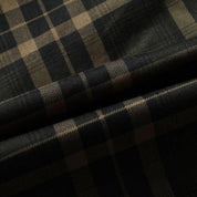 Tessuto scozzese nero e beige, motivo a quadri, ideale per abbigliamento moda, sartoria, alta qualità, stile classico ed elegante.