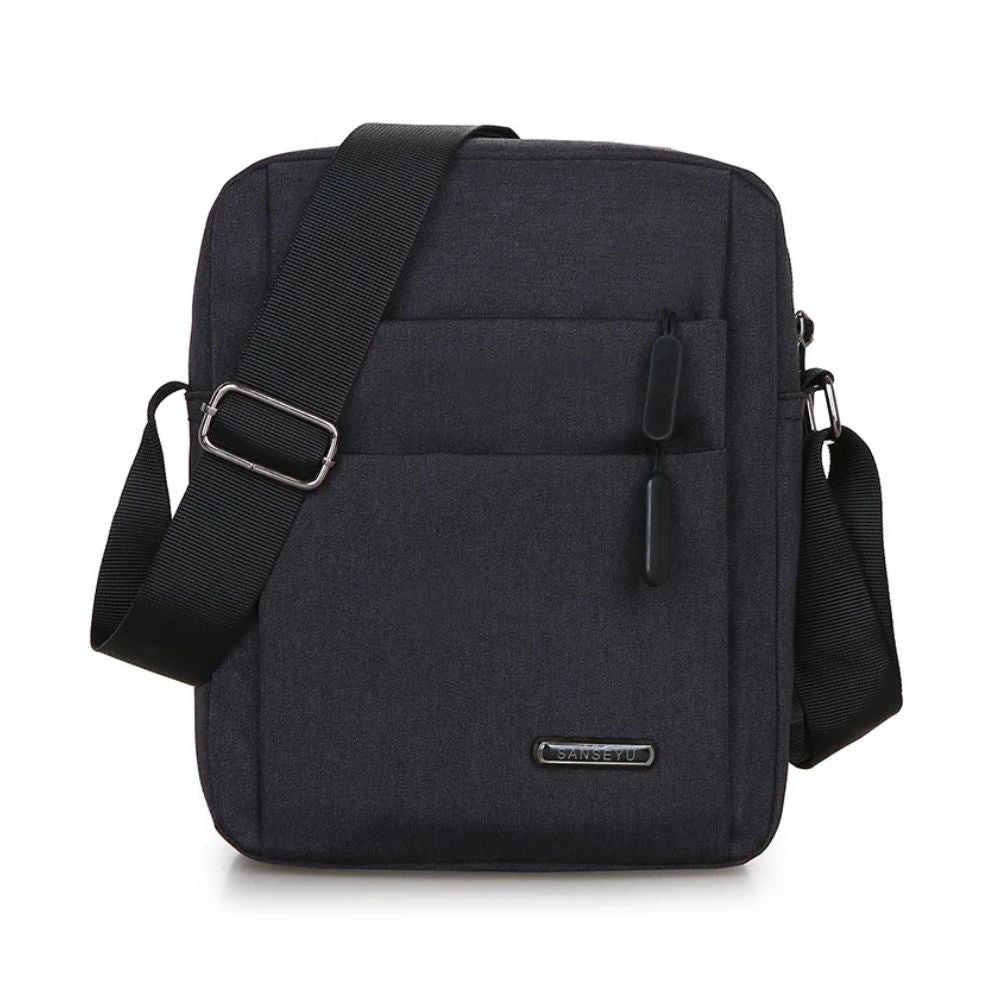 Borsa a tracolla nera unisex, design moderno, tasche multiple, chiusura con zip, ideale per lavoro e viaggio. Accessorio moda pratico e versatile.