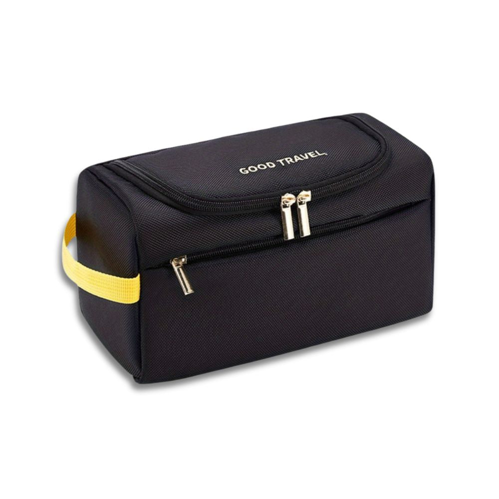 Borsa da viaggio nera con manico giallo, doppia cerniera e scritta "Good Travel". Ideale per organizzare accessori da viaggio.