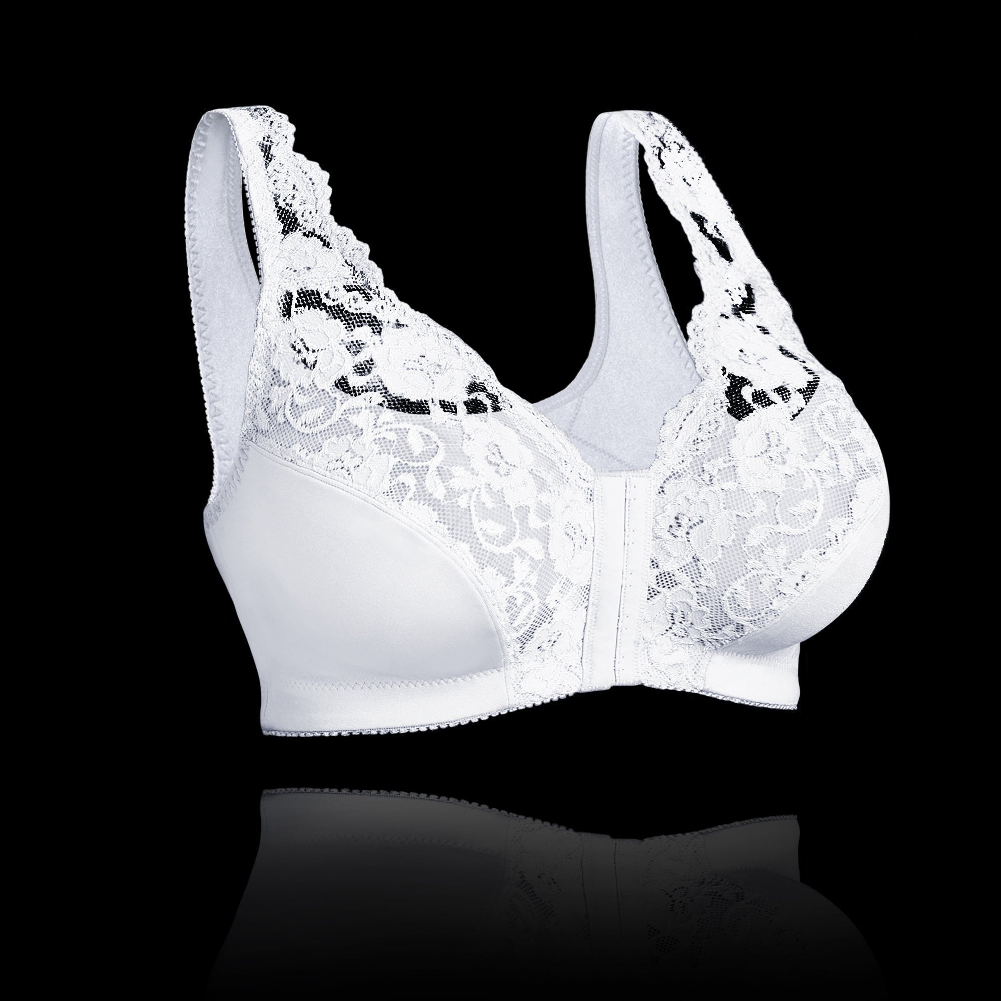 Reggiseno bianco in pizzo floreale, senza ferretto, su sfondo nero. Intimo femminile elegante, comfort e supporto.