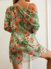 Abito estivo donna floreale, trasparente, con stampa tropicale di fiori e ananas, manica lunga, ideale per spiaggia o vacanza.