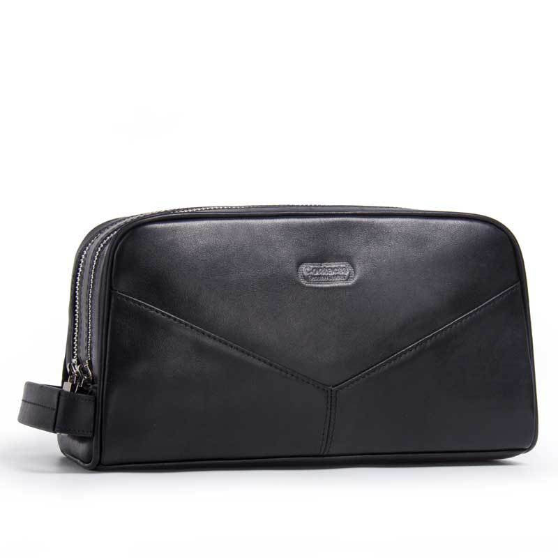 Elegante borsa da toilette in pelle nera con cerniera, design moderno e manico laterale. Accessorio di lusso per viaggi e organizzazione.