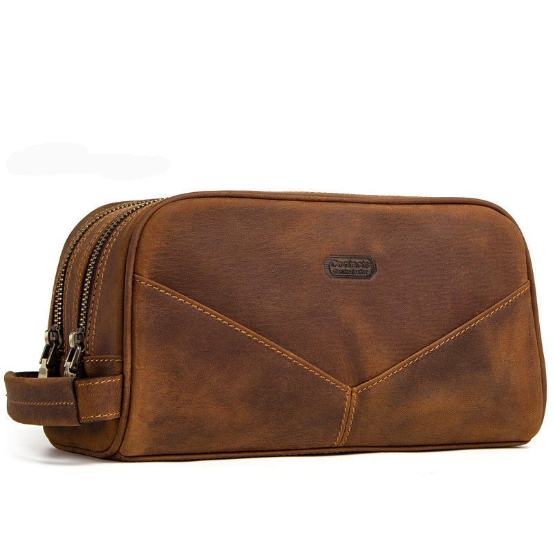 Borsello da viaggio in pelle marrone, design elegante con doppia cerniera, ideale per uomo. Accessorio pratico per organizzare articoli da toeletta.