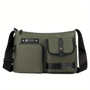 Borsa a tracolla verde militare con tasche multiple, chiusura a zip e fibbia, design unisex, ideale per viaggi e uso quotidiano.