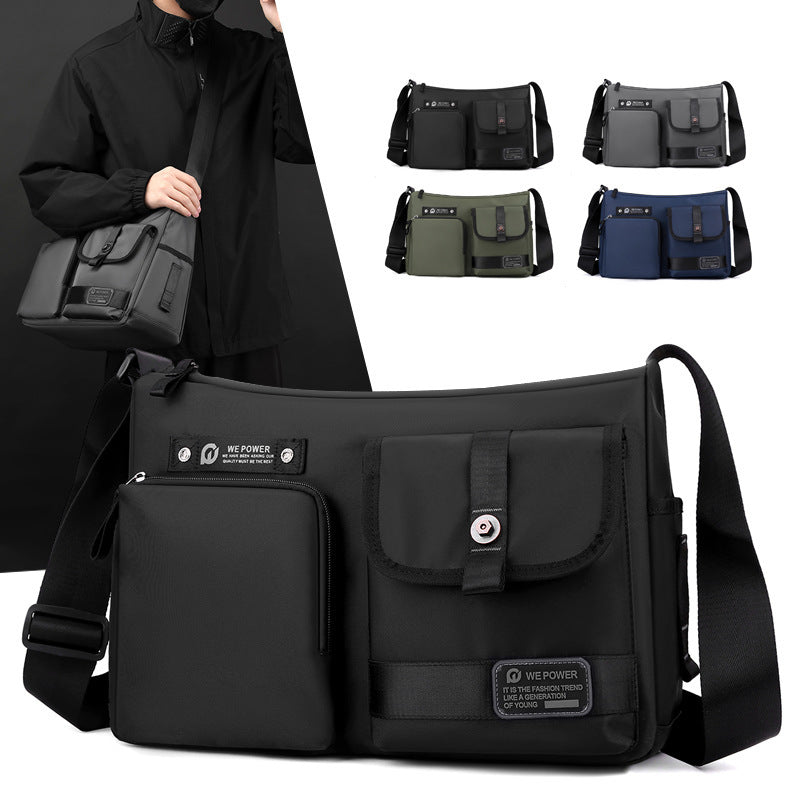 Borsa a tracolla nera unisex, design moderno con tasche multiple, disponibile in vari colori. Ideale per lavoro e viaggio. Accessorio moda pratico.