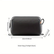 Borsa da toilette nera, dimensioni 22x15x11,5 cm, con cerniera e manici laterali. Ideale per viaggi, resistente e compatta.