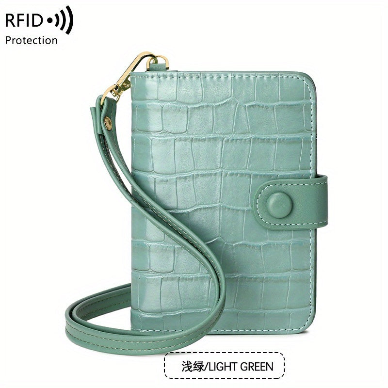 Portafoglio donna verde chiaro in pelle con texture coccodrillo, cinturino da polso, protezione RFID. Elegante e sicuro per carte e contanti.