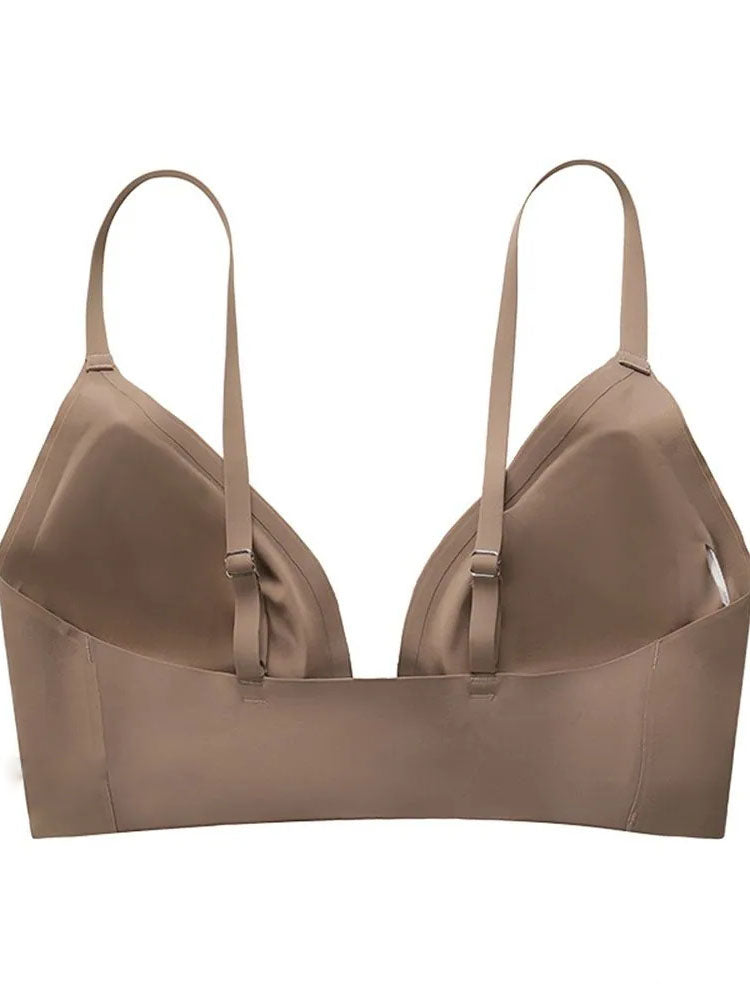 Reggiseno senza cuciture color nude, spalline regolabili, design minimalista, comfort quotidiano, intimo donna, supporto leggero, moda intima.