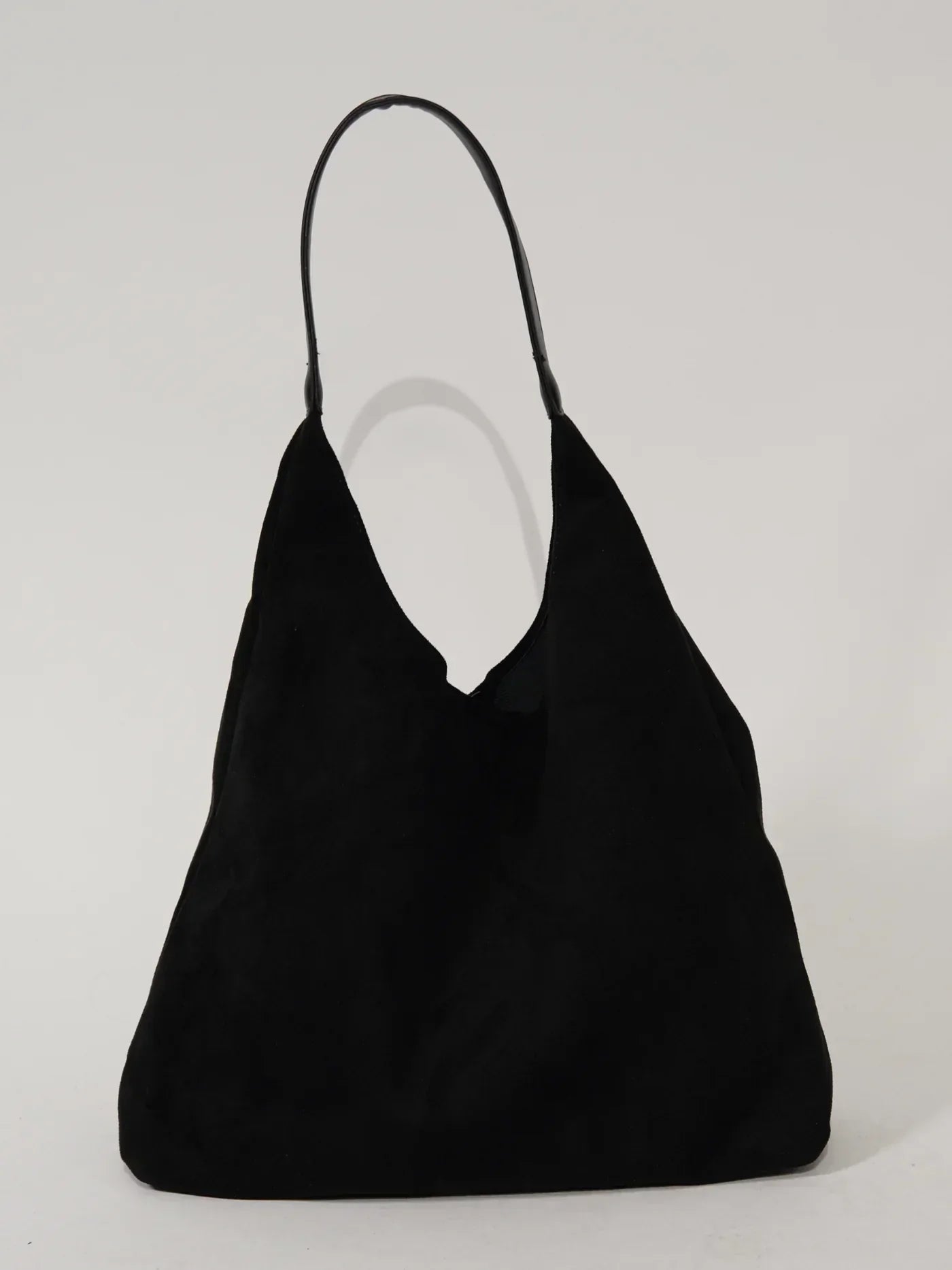 Borsa a spalla nera in pelle scamosciata, design minimalista, manico singolo, ideale per moda donna, accessorio elegante e versatile.