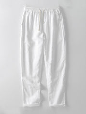 Pantaloni bianchi in cotone, stile casual, con elastico in vita e tasche laterali. Ideali per look estivi e abbigliamento quotidiano.