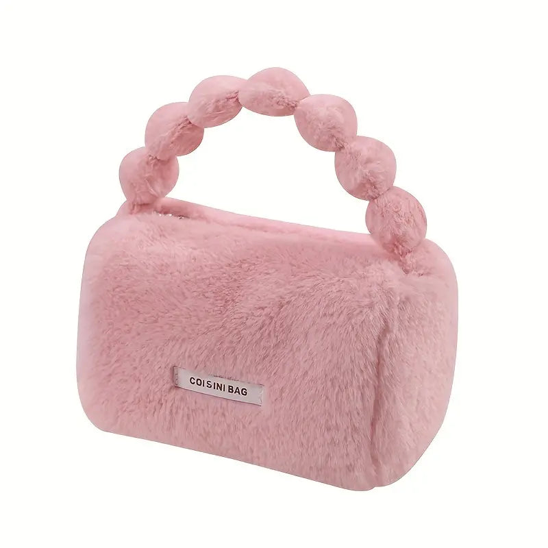 Borsa a mano rosa in pelliccia sintetica con manico a perle, design elegante e moderno, perfetta per moda femminile e accessori di tendenza.
