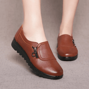 Scarpe da donna in pelle marrone con cerniera, suola antiscivolo nera, design casual elegante, ideali per l'autunno e l'inverno.