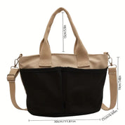 Borsa a tracolla donna in tela bicolore beige e nera, con manici e tracolla regolabile. Dimensioni: 30x19x17 cm. Elegante e pratica per ogni occasione.