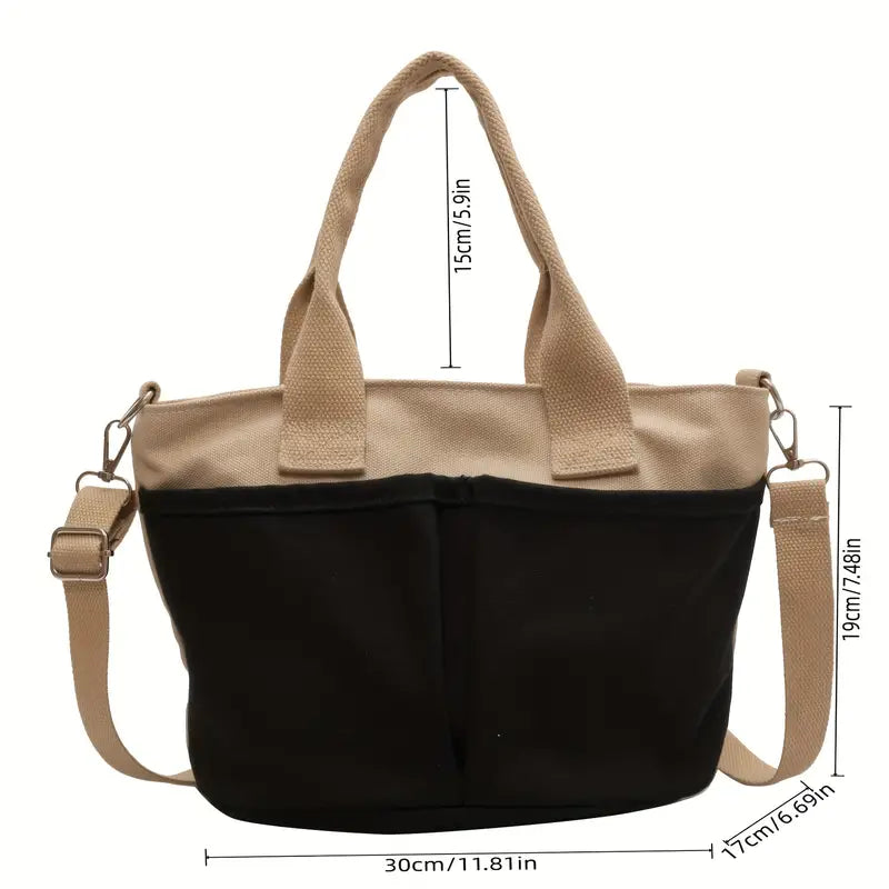 Borsa a tracolla donna in tela bicolore beige e nera, con manici e tracolla regolabile. Dimensioni: 30x19x17 cm. Elegante e pratica per ogni occasione.