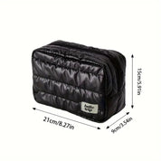 Borsa da viaggio nera imbottita, dimensioni 21x9x15 cm, ideale per organizzare accessori. Design compatto e resistente, perfetto per viaggi.