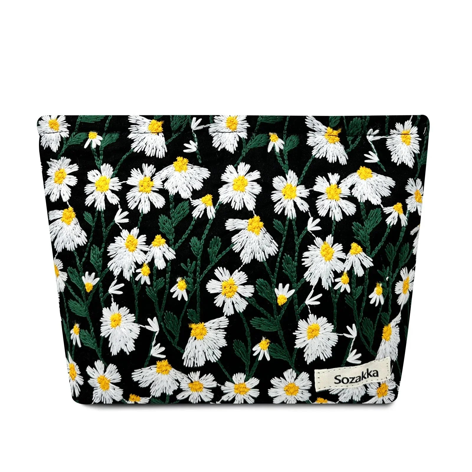 Astuccio nero con motivo floreale di margherite bianche e gialle, marchio Sozakka. Accessorio moda elegante e pratico per organizzare oggetti personali.