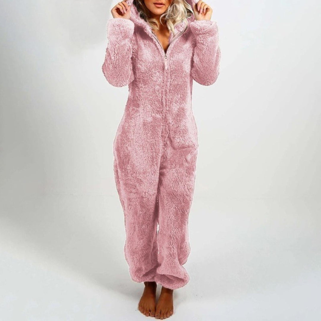 Tuta pigiama donna in pile rosa, morbida e calda, con cappuccio. Ideale per l'inverno, comfort e stile per la casa.