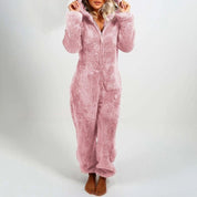 Tuta pigiama donna in pile rosa, morbida e calda, con cappuccio. Ideale per l'inverno, comfort e stile per la casa.