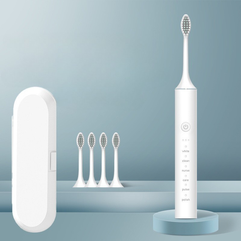 Spazzolino elettrico bianco con testine di ricambio e custodia, design moderno, ideale per igiene orale avanzata e pulizia dentale efficace.
