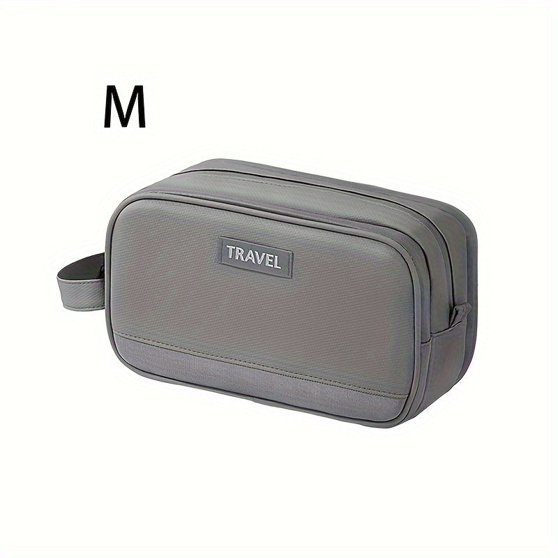 Astuccio da viaggio grigio taglia M, con manico laterale e doppia cerniera, ideale per organizzare accessori e articoli da toeletta.
