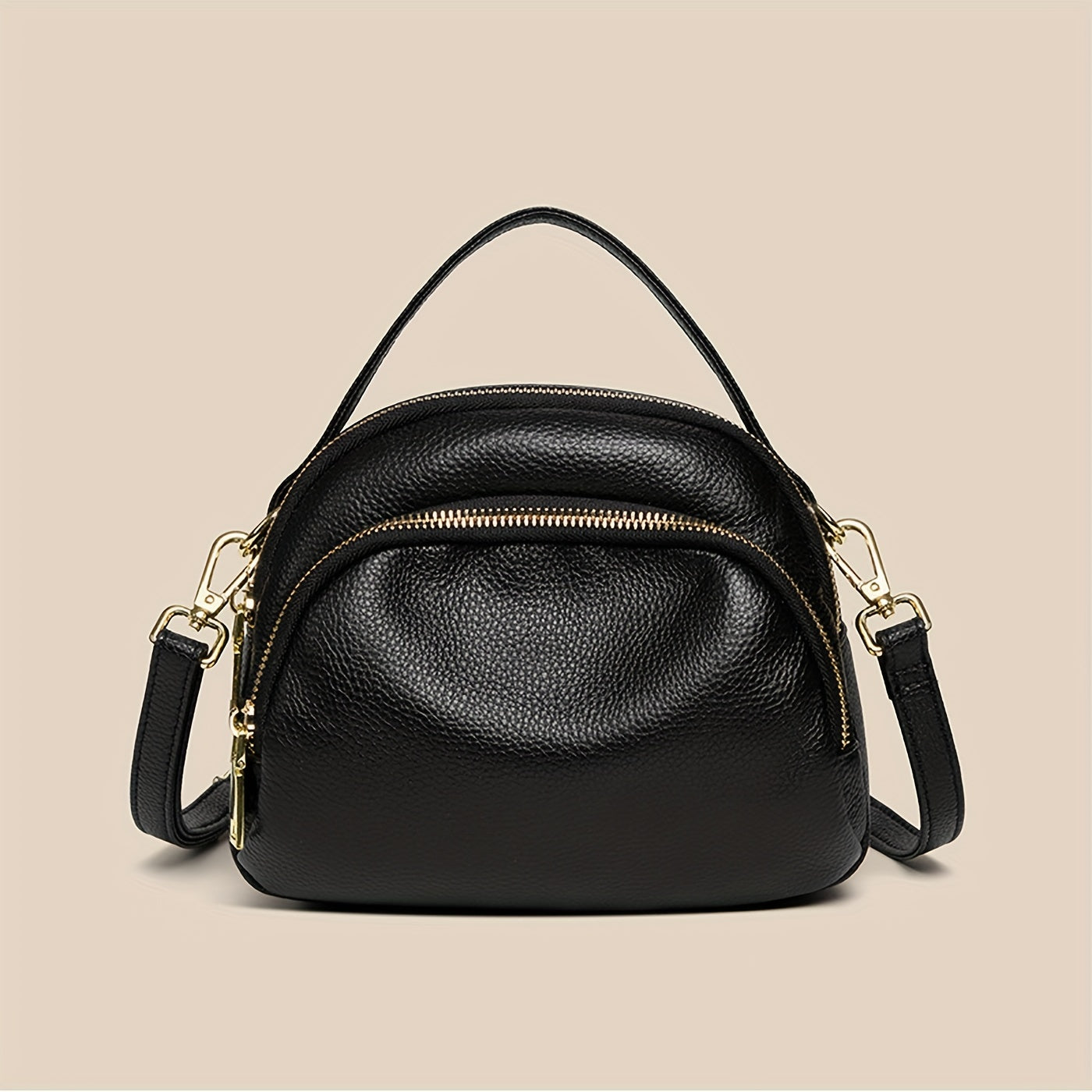 Borsa a tracolla in pelle nera con doppia zip e dettagli dorati, design elegante e compatto, perfetta per moda donna e accessori di lusso.