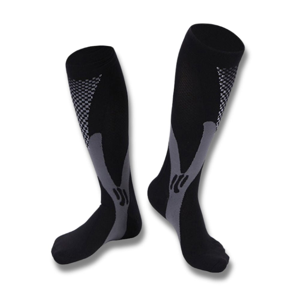 Calze a compressione nere e grigie, design ergonomico, ideali per sport e viaggi. Materiale traspirante, supporto muscolare, taglia unica.