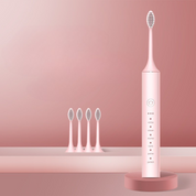 Spazzolino elettrico rosa con testine di ricambio, design moderno, funzioni multiple per sbiancamento e pulizia dentale efficace.