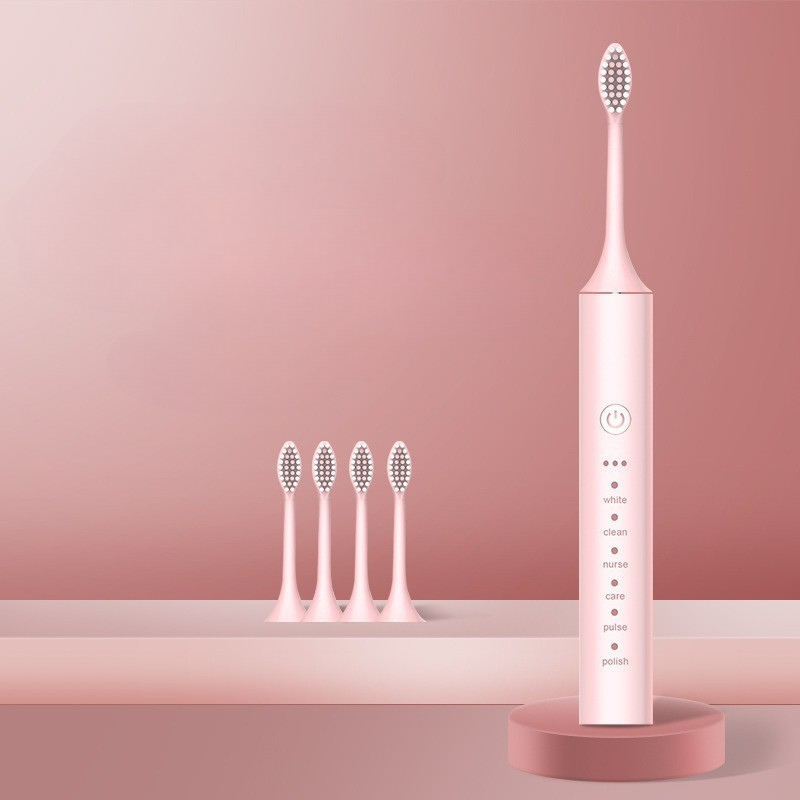 Spazzolino elettrico rosa con testine di ricambio, design moderno, funzioni multiple per sbiancamento e pulizia dentale. Accessorio bagno elegante.