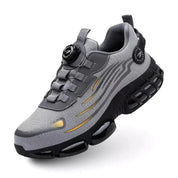 Scarpa sportiva da uomo grigia con suola ammortizzata, design moderno e dettagli neri. Ideale per corsa e allenamento. Comfort e stile.