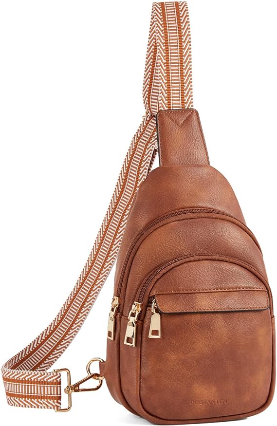 Zaino monospalla in pelle marrone con cerniere dorate e tracolla regolabile a righe. Design elegante e pratico per uso quotidiano.