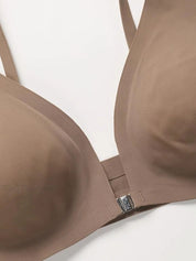 Reggiseno push-up marrone senza cuciture, chiusura frontale, spalline regolabili, design liscio e confortevole, ideale per supporto e sollevamento.