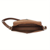 Borsa a tracolla in pelle marrone, vista dall'alto, con scomparto interno spazioso. Accessorio moda elegante e pratico per donna.