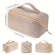 Borsa cosmetica glitterata beige con cerniera dorata, manico superiore, dimensioni 24x12x12 cm. Ideale per trucco e accessori viaggio.