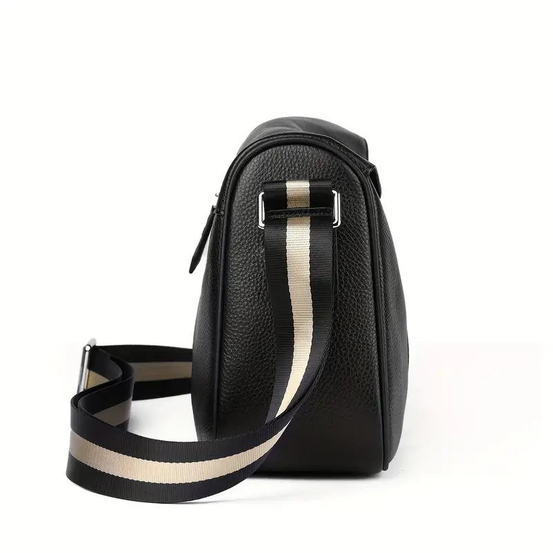 Borsa a tracolla in pelle nera con cinturino regolabile a righe beige e nere, design elegante e moderno, accessorio moda donna.