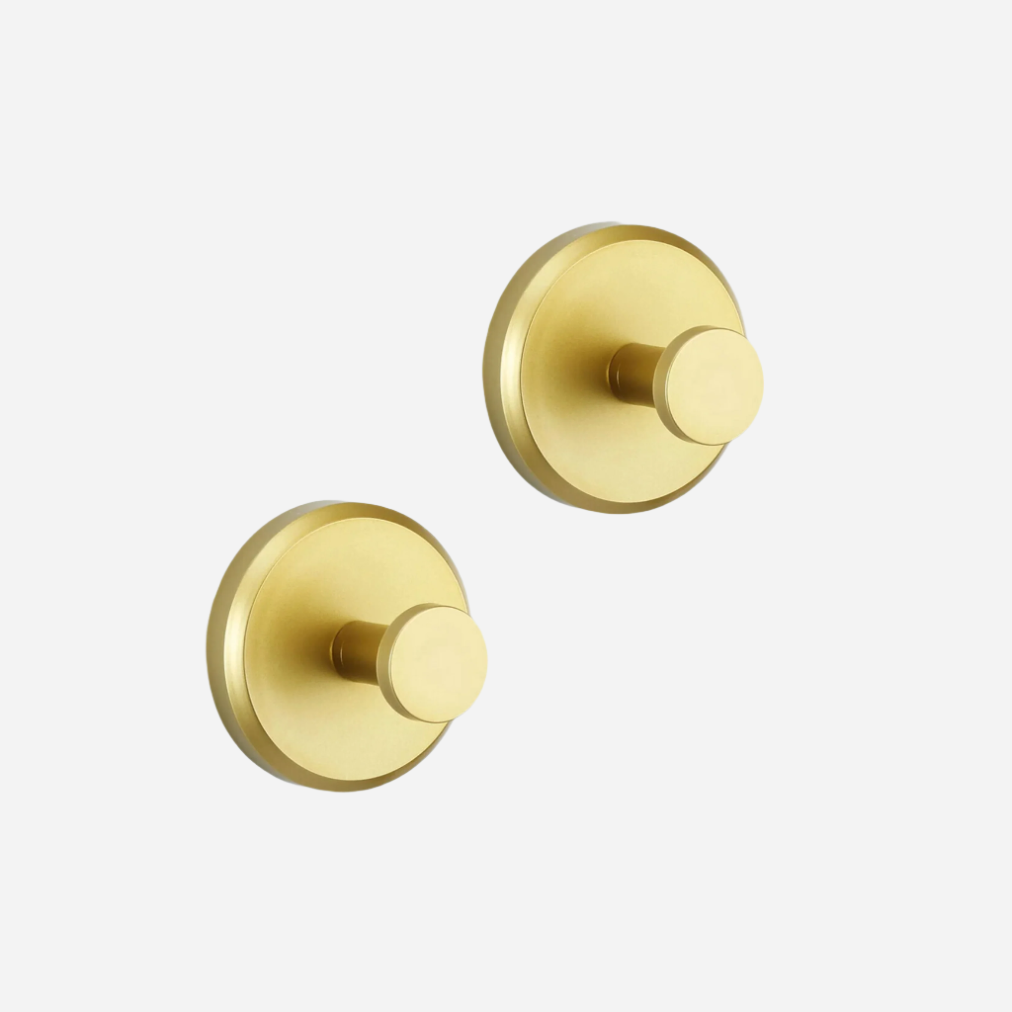 Coppia di ganci appendiabiti in ottone dorato, design moderno e minimalista, ideali per bagno o cucina. Accessori eleganti e funzionali.