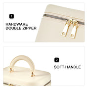 Borsa beige con doppia cerniera in metallo e manico morbido. Design elegante, ideale per moda femminile e accessori di lusso.