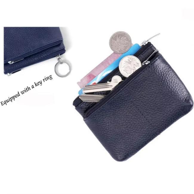 Portamonete in pelle blu con cerniera, anello portachiavi, monete e banconote visibili. Accessorio compatto e pratico per organizzare denaro e chiavi.
