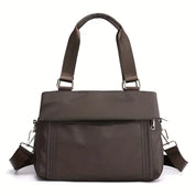 Borsa a tracolla marrone in pelle sintetica, design elegante con cerniera, manici regolabili, ideale per donna, moda autunno inverno.