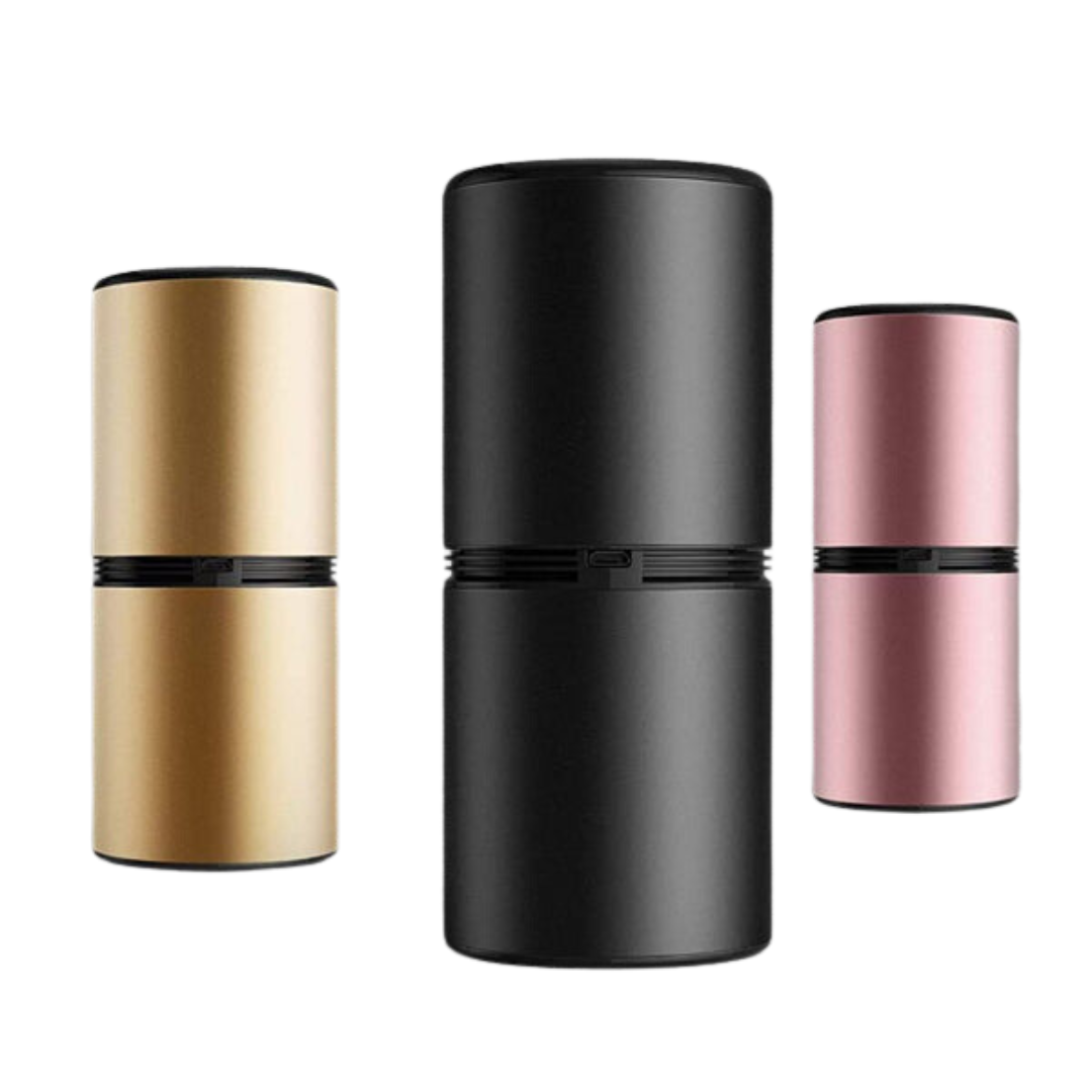 Tre diffusori di aromi portatili in metallo, colori oro, nero e rosa, design cilindrico moderno, ideali per aromaterapia e ambienti interni.
