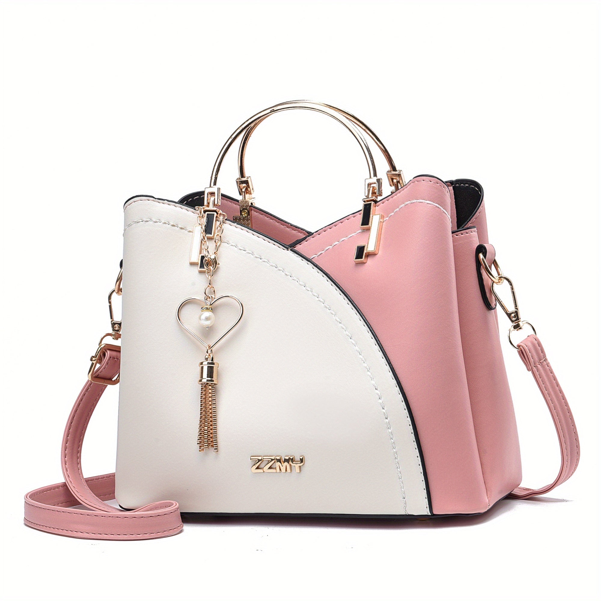 Borsa a mano donna in pelle bicolore rosa e bianca, con manici dorati e tracolla regolabile. Design elegante con ciondolo a cuore.
