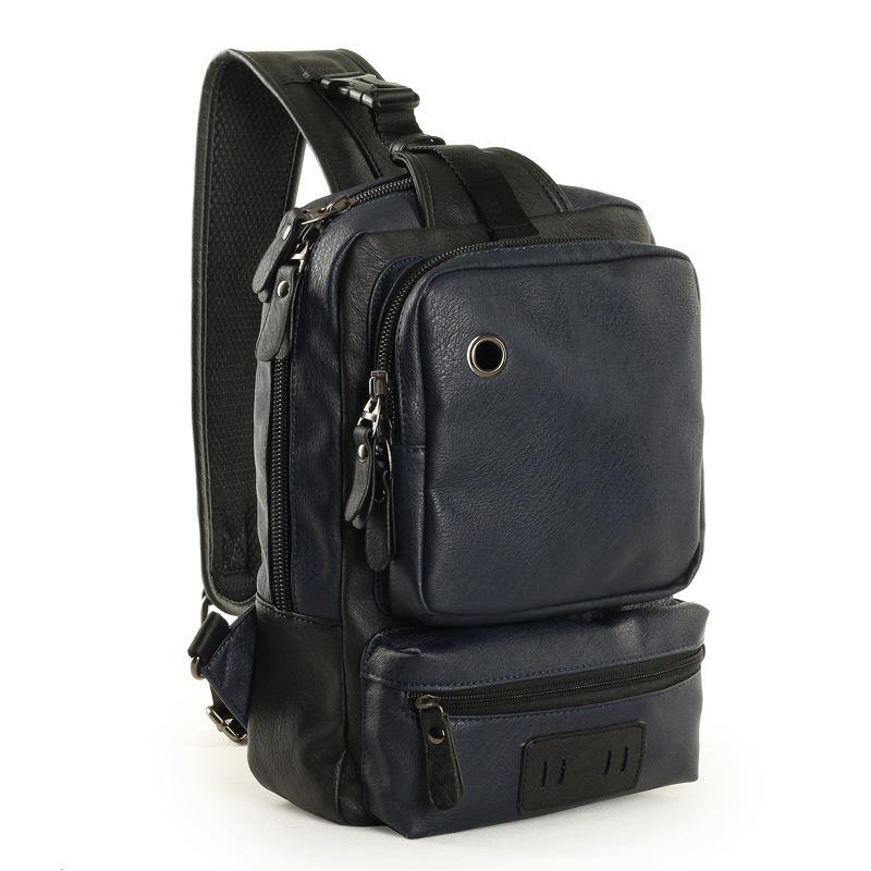 Zaino monospalla in pelle nera, design moderno con tasche multiple e cerniere, ideale per viaggi e uso quotidiano. Accessorio moda uomo.