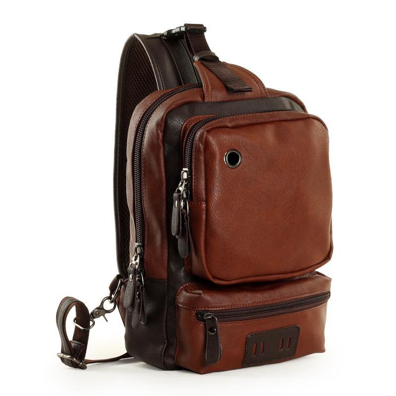 Zaino a tracolla in pelle marrone, design elegante e compatto, con tasche multiple e cerniere robuste. Ideale per viaggi e uso quotidiano.