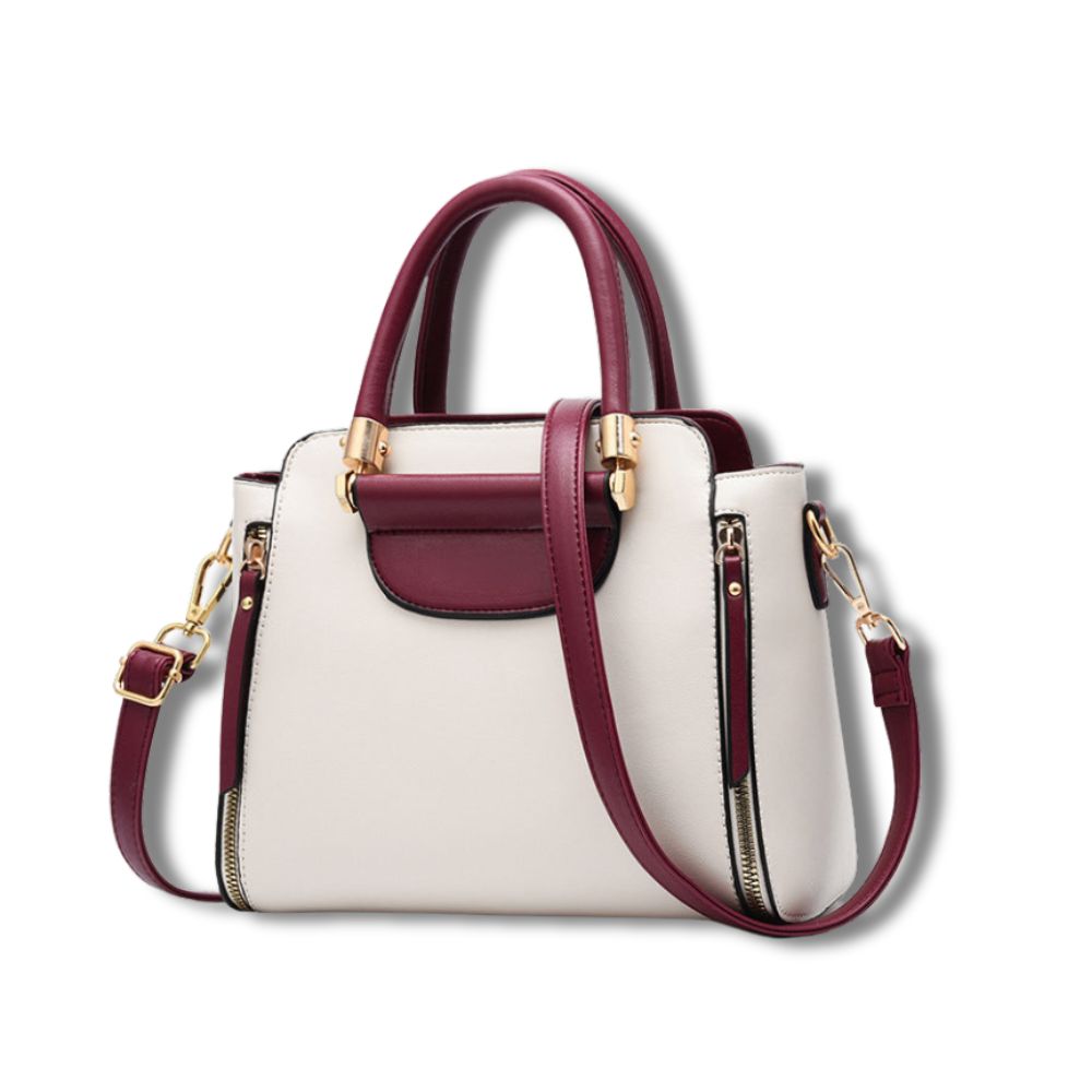 Borsa a mano elegante in pelle bicolore bianca e bordeaux, con tracolla regolabile e dettagli dorati. Design moderno e raffinato per donna.